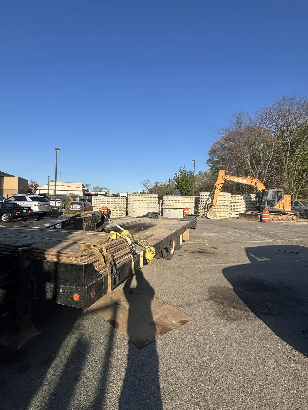 Commercial cesspool installation with flatbed and excavator — Rapid Response
